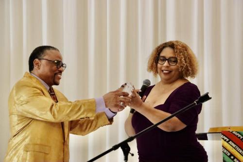 Charles and Rakesia with award